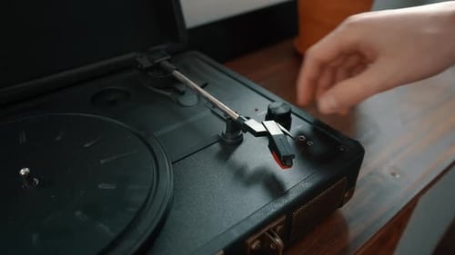 Turning on a Vintage Record Player