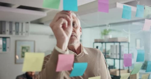 Sticky note, business and mature man in office for task agenda, project ideas and schedule
