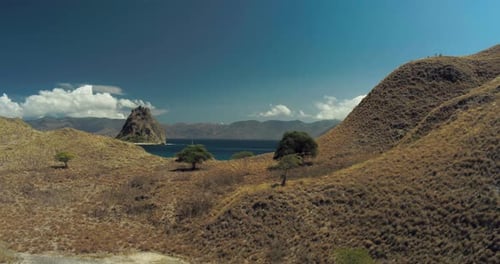 Cinematic Drone Shot of Padar Island Landscape Under Clear Blue Sky