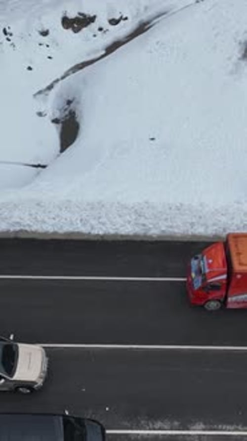 Vertical Video Bird's Eye View of SnowCovered Mountain Tunnels