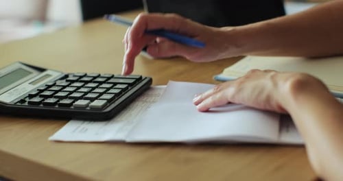 Businesswoman Use Calculator and Check Finances Income and Budget of Company