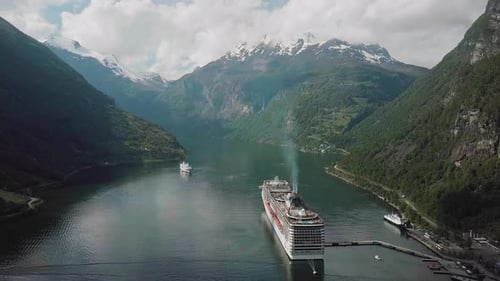 Cruise Ship in Fjord surrounded by Mountains