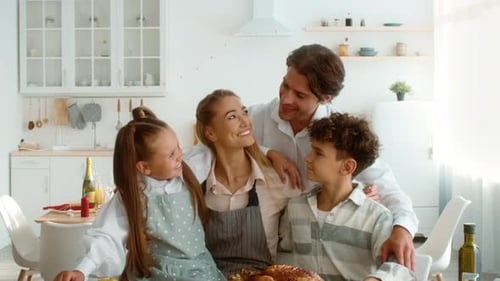 Happy Family Together in Bright Kitchen at Home