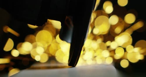 Close Up of Saw Cutting Metal with Sparks