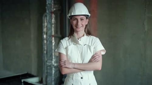 Portrait of a Female Engineer on a Construction Site Looking Into the Camera A Young Female