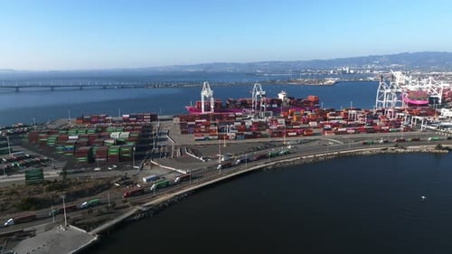 Logistics and Transportation of Container Cargo Ship with Working Crane Bridge in Shipyard