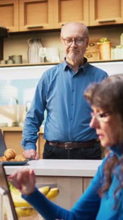 Senior Couple Video Calling in Sunny Kitchen