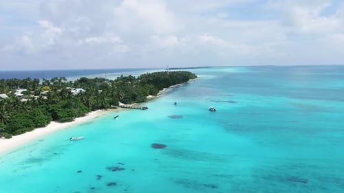 Aerial view of tropical island and beach, Maldives.