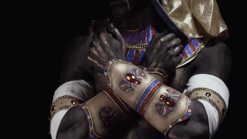 Close up of Anubis with his hands crossed, long claws, spreading his fingers