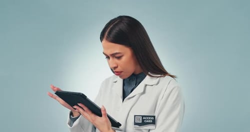 Tablet, doctor and confused with a science woman in studio on a gray background for research