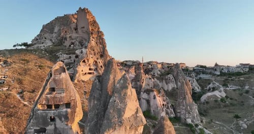Aerial View of Natural Rock Formations in the Sunset Valley with Cave Houses in Cappadocia Turkey