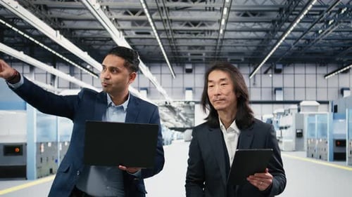 Microchip Manufacturing Plant Multiethnic Engineering Team Tracks Semiconductors