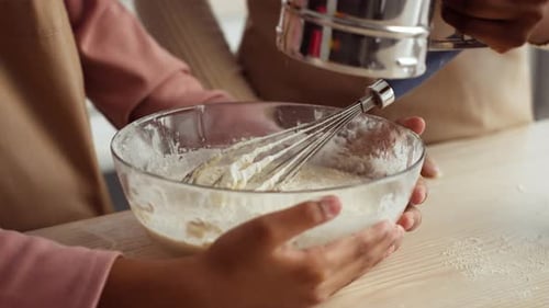 Mother and Daughter Baking Together at Home Creating Delicious Pastries