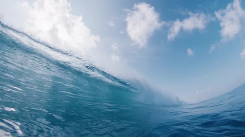 Crystal Clear Ocean Wave Breaks on the Shore in the Maldives