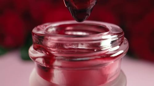 Acid Peeling Dripping From Pipette Into Glass bottleAbstract Skin Care Products