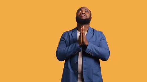 Man Praying to His God Asking for Forgiveness Studio Background