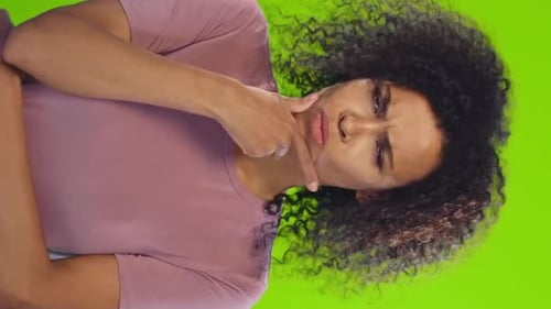 Young Woman With Arms Crossed Looking Annoyed