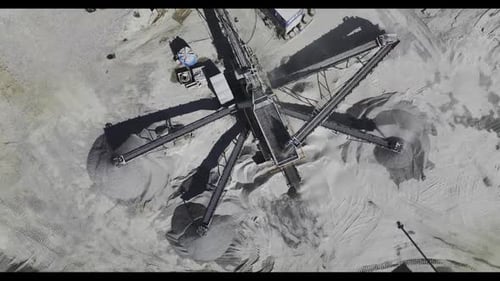 Excavator Rides on Territory of Asphalt Manufacturing for Roads