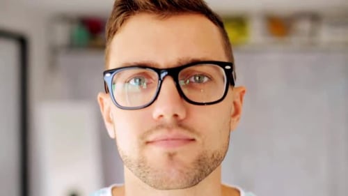 Man With Glasses Smiling at the Camera