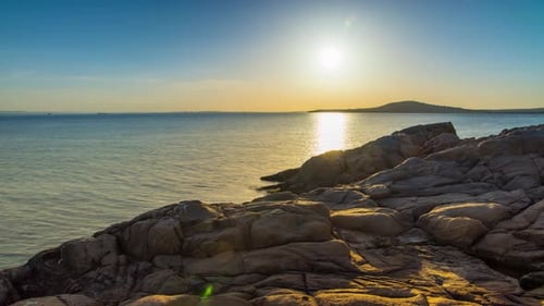 A Beach with Sand and Stones Near the Black Sea Under Sunset Light in Bulgaria