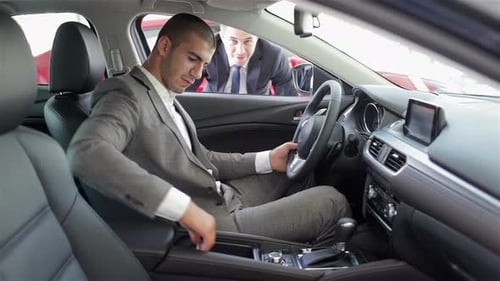 Man at a Car Dealership Buying an Auto