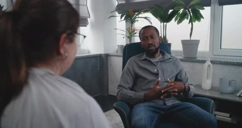 Man Talking During Therapy Session Indoors