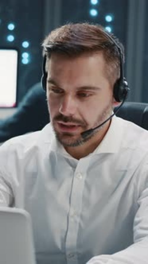 Footage of Serious Focused Young Handsome Caucasian Man Talking Via Video Call with Client Resolving