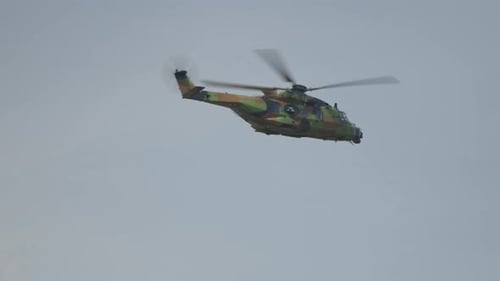 Military Helicopter Flying in the Sky