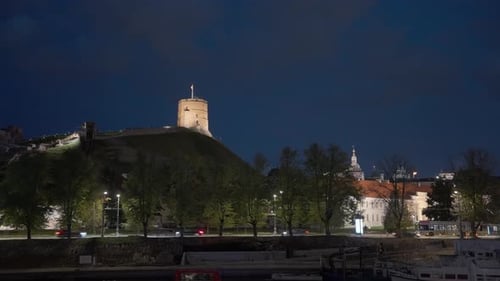Illuminated Tower Overlooking City at Night