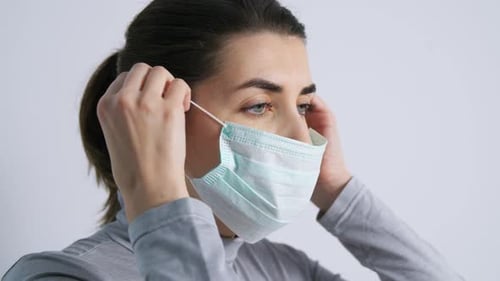 Health, Safety and Pandemic Concept - Close Up of Young Woman Wearing