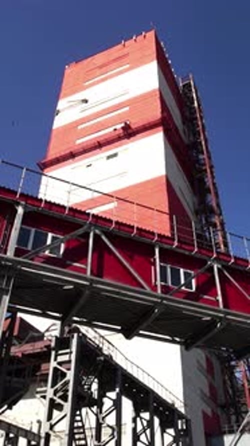 The Industrial Structure Stands Tall Against the Clear Blue Sky Creating a Stunning Contrast Stock