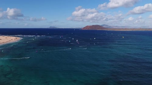 Beautiful Coastline with Turquoise Waters and Kitesurfers