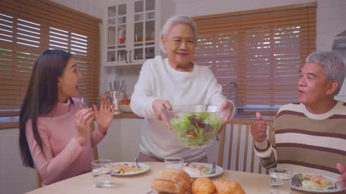 Family enjoying meal together in kitchen