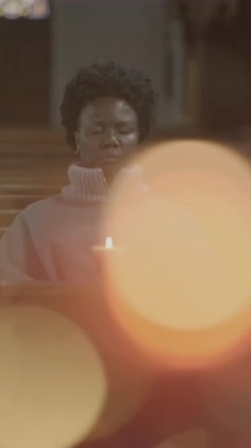 A Contemplative Moment in a Dimly Lit Church Reflecting on Faith and Communitys Blessings