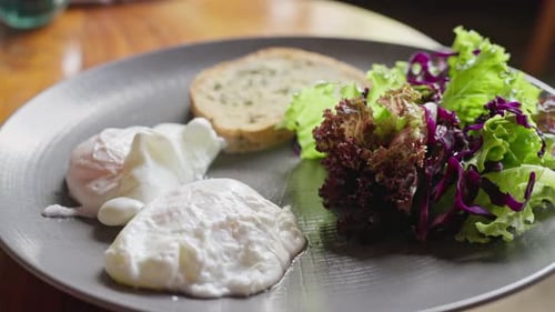 Appetizing Poached Eggs with Toast and Salad