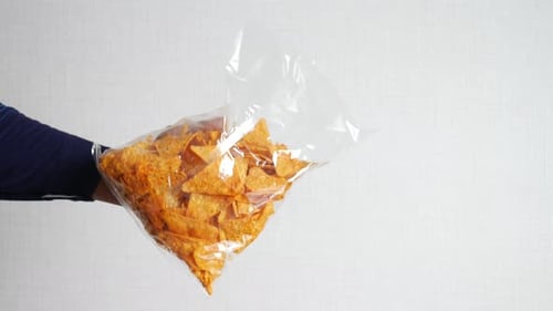 Holding a Open Potato Chips Packet