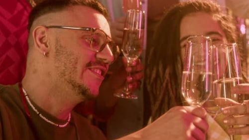 Diverse Group of Friends Celebrate Together With Champagne