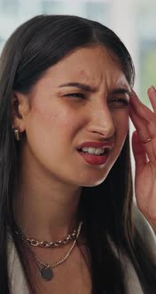 Young Woman Experiencing Headache and Discomfort