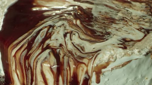 Chocolate and Vanilla Cake Icing Drizzled Close Up