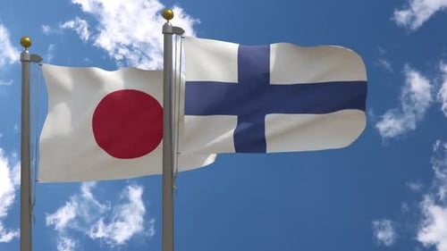 Japan and Finland Flags Waving in Wind Against Blue Sky