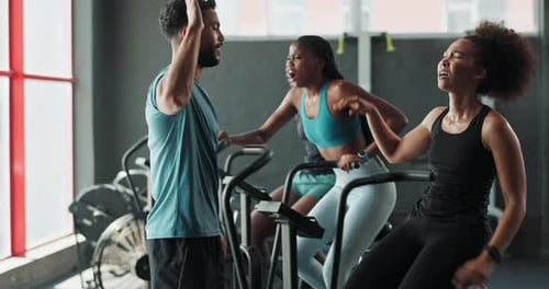 People Exercising at the Gym Together