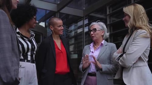 Group of Professional Women Talking Outside Office Building