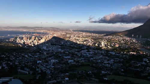 Panorama view of Cape Town with foggy mystic Table mountain in sunset glow