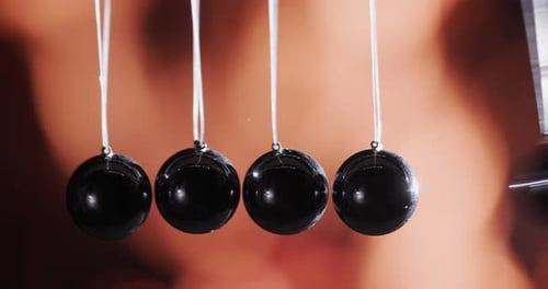 Swinging Newton's Cradle with Macro Close-Up