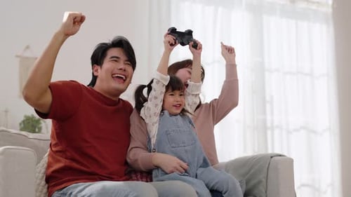 Happy Family Playing Video Games at Home
