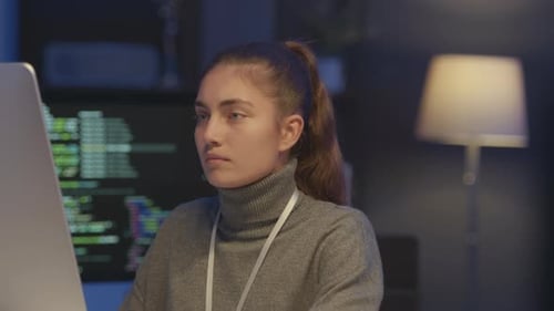 Tired Female Programmer Overworking at Night