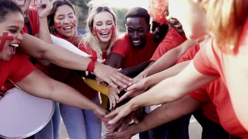 Crowd Red sport football fans celebrating final champion on stadium - Soccer hooligans stacking hand