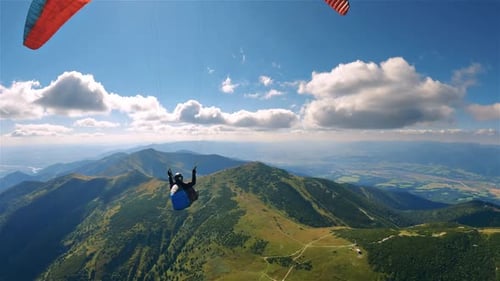 Paragliding Freedom of Peaceful Flying Above Green Mountains