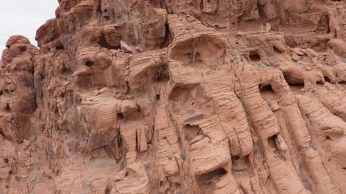 Aerial revealing shot of valley of fire behind the textured Red Sandstones in Nevada
