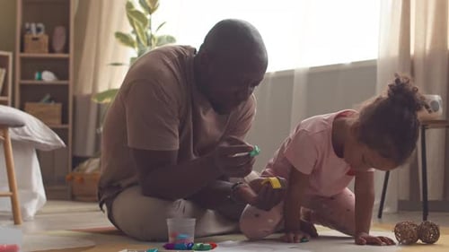 Father and Child Playing on Floor Together